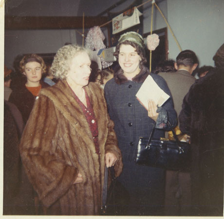 Coloured photograph of Mrs Harcourt Roberts on the left - two ladies at a meeting